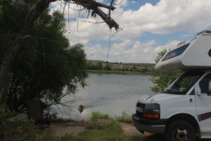 Yeah, that's me knee paddling my logboard in... a lake...